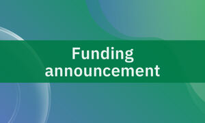Text saying &quot;Funding announcement&quot; on green background.