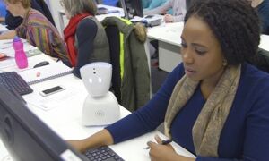 Small white robot with bioinformatics student
