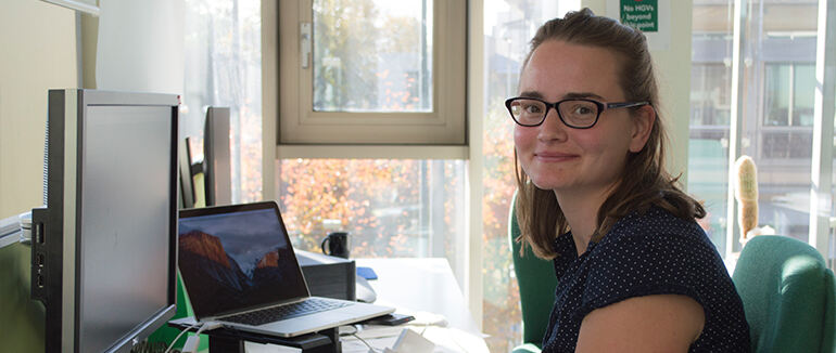 Image of EMBL-EBI staff member at her desk